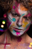 Colourful creative makeup with a sprinkling of glitter and twinkly lights