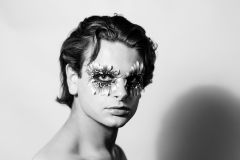 Black and white headshot of avant garde makeup