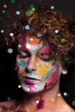 Colourful creative makeup with a sprinkling of glitter and twinkly lights