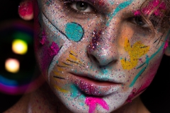 Colourful creative makeup with a sprinkling of glitter and twinkly lights