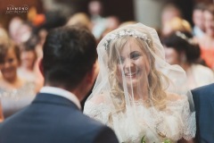 A gorgeous shot of Bride Steph during the service looking at her groom. Wedding took place at The Lordstones in North Yorkshire. Makeup by Gemma Rimmington.