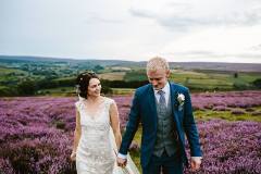 Bride Laura and her Groom walking along the North Yorkshire Moors at Danby, North Yorkshire. Photography by www.georginabrewster.com. Makeup by Gemma Rimmington.