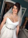 Happy bride Nicola is dressed and ready to set off to her wedding. Her bridal makeup is polished and glamourous.