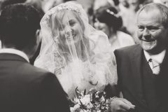 Beautiful image of Bride Steph with her dad and her groom at the church before her Wedding reception at Lordstones, North Yorkshire. Makeup by Gemma Rimmington.