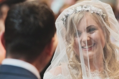 A gorgeous shot of Bride Steph during the service looking at her groom. Wedding took place at The Lordstones in North Yorkshire. Makeup by Gemma Rimmington.