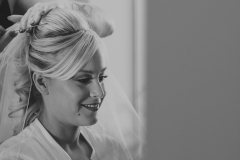 Bride Hannah getting the finishing touches done to her hair and makeup before her wedding at Wrays Barn, Great Ayton.