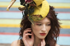 Editorial style makeup, bright orange lips, flawless foundation and a high fashion headpiece.  Photoshoot took place at Tate Modern London