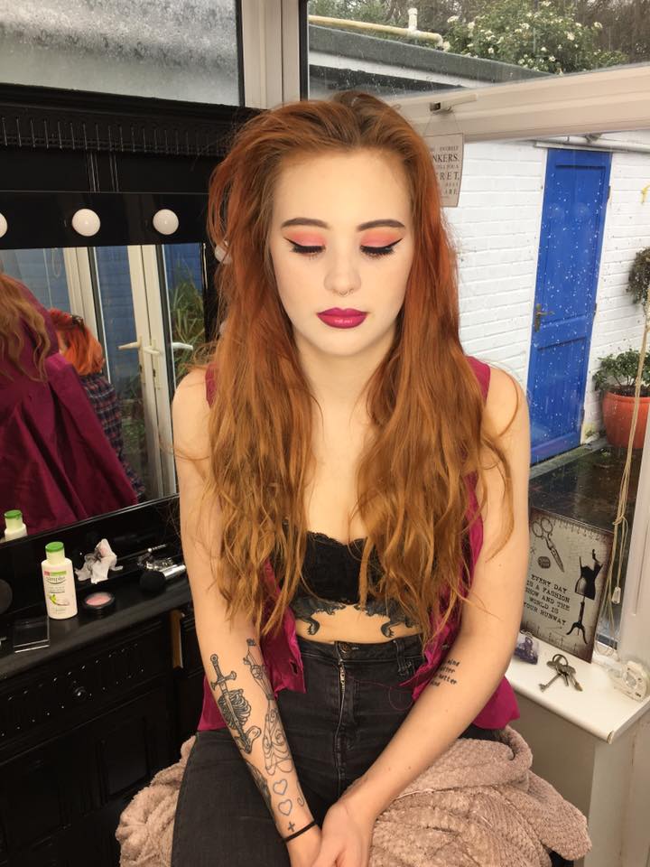 Lottie just finished getting her makeup done in the studio