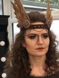 Amy in the makeup studio. Strong makeup to accompany the strong overall look