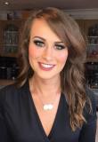 Becca's wearing dark smokey eyes perfect for a glamorous occasion