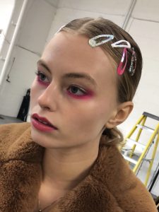 Glossy skin and bright pink neon eye makeup for fashion photoshoot on model Ashley Graves from Milk Model Agency in London.  Makeup by Gemma Rimmington